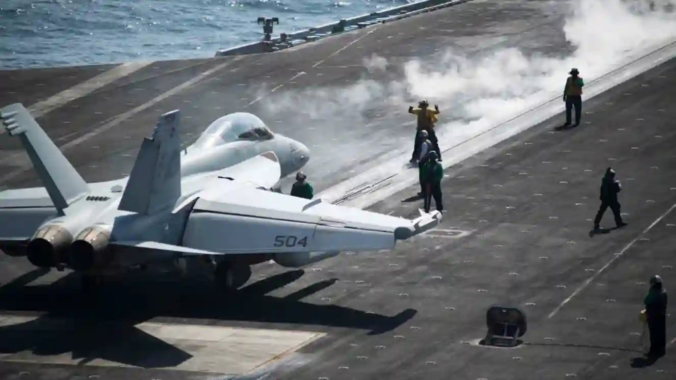 An EA 18G Growler crew assigned to the Zappers of Electronic Attack Squadron 130 prepares to launch from the flight deck of the aircraft carrier USS Harry S. Truman (CVN 75).