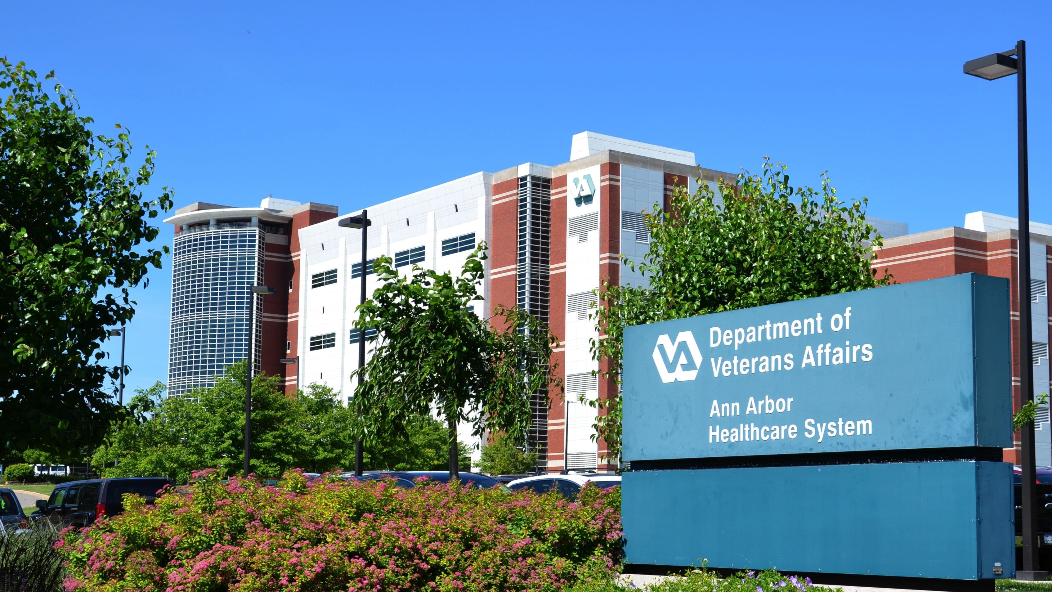 Outside bldg with sign for An Arbor Dept of VA.