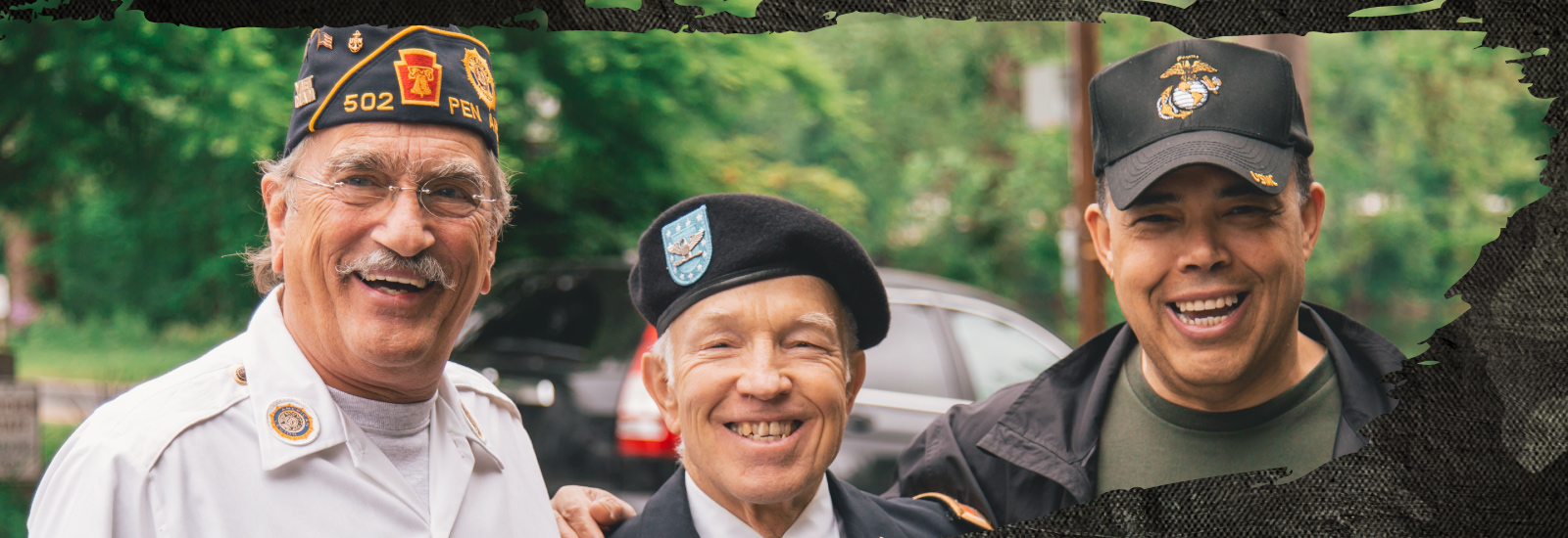 three military Veterans smiling