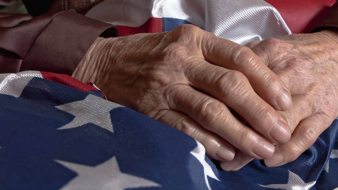 Veteran's hands with American flag