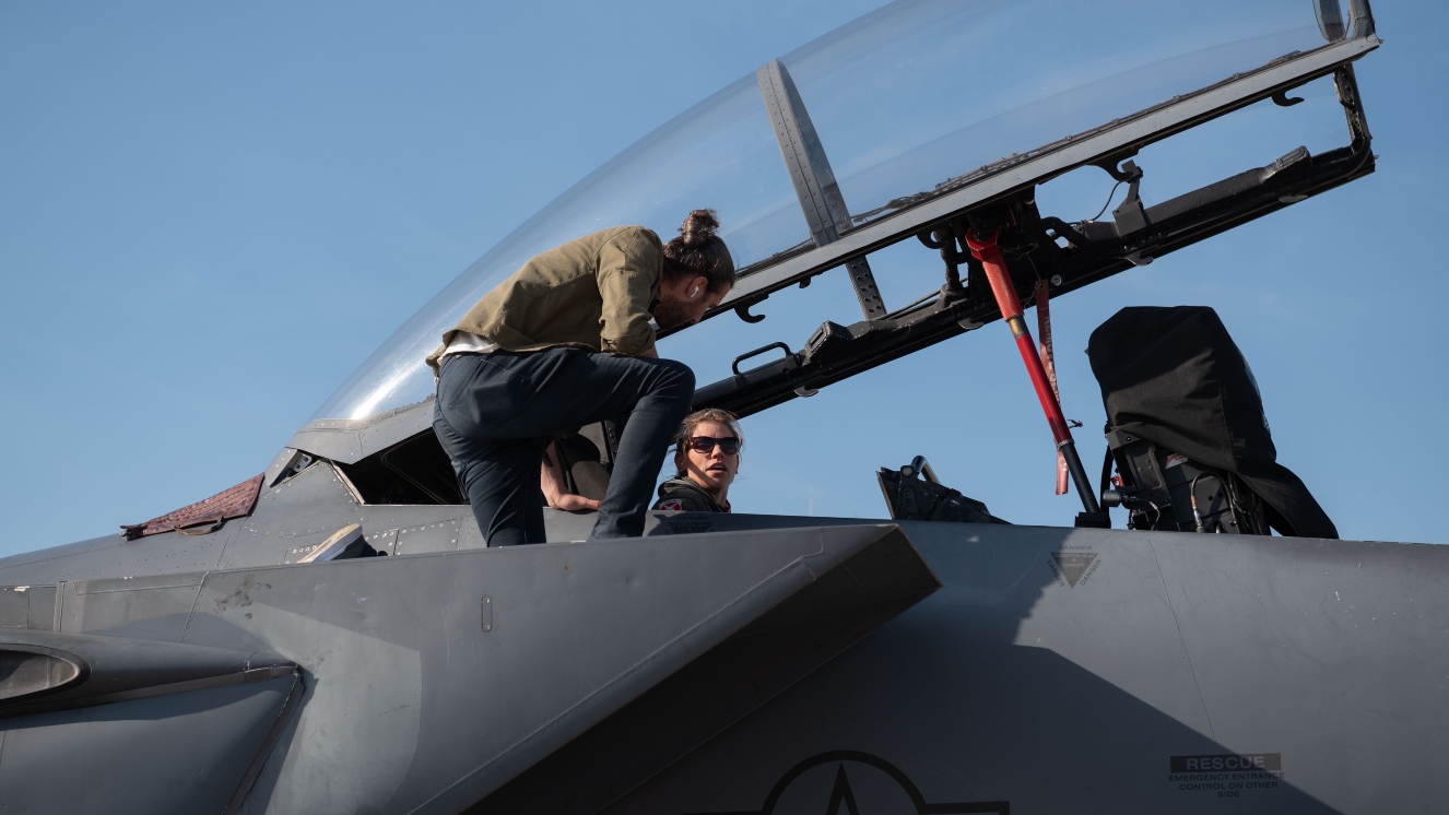 Capt. Kelsey Eastham, weapons system operator 333th Fighter Squadron, and Colt Seman, Arion chief of design, discuss a new in-flight relief system called Airus by Airion Health for female pilots at Seymour Johnson Air Force Base, North Carolina, Feb. 15, 2023.