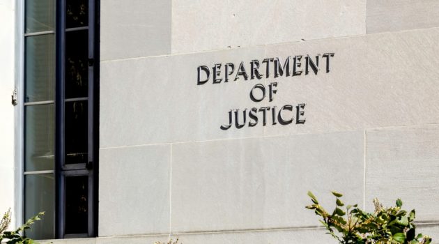The sign at the Department of Justice in Washington D.C., where charges against Ethan Melzer were brought for his role in attempting to harm his own unit.