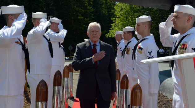For Jimmy Carter, military service was formative. Here he attends a ceremony for the change of command for the USS Jimmy Carter at Naval Base Kitsap - Bangor.