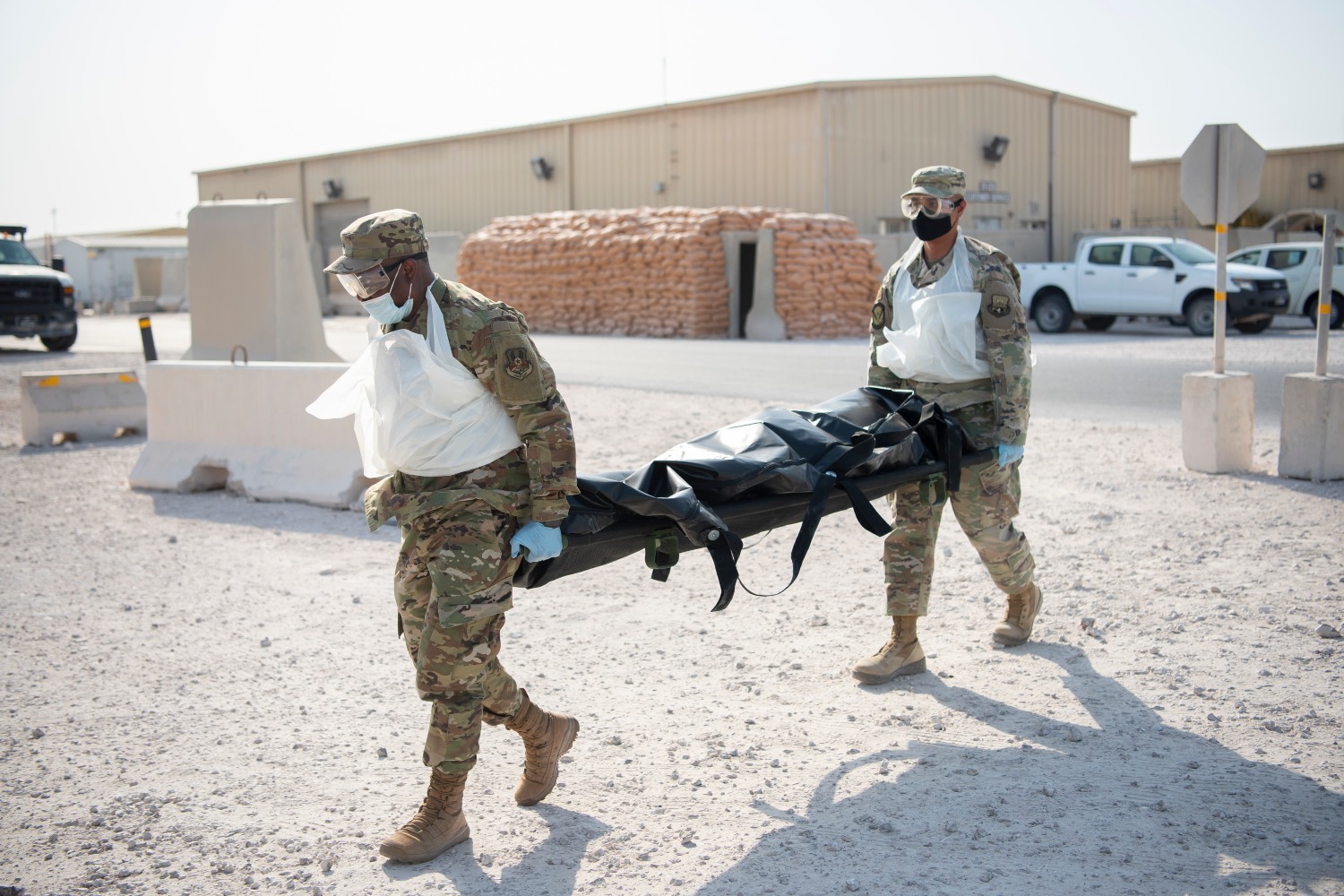 U.S. Air Force Airmen from the 379th Expeditionary Force Support Squadron Mortuary Affairs Office practice an exercise to help prevent military training deaths. 