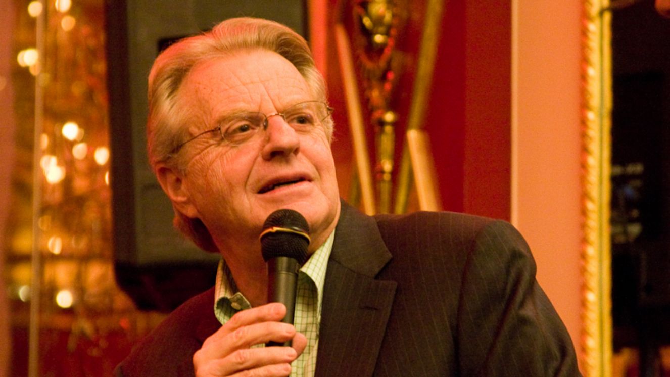 Jerry Springer, host of the Jerry Springer Show, speaks into a microphone at an event.