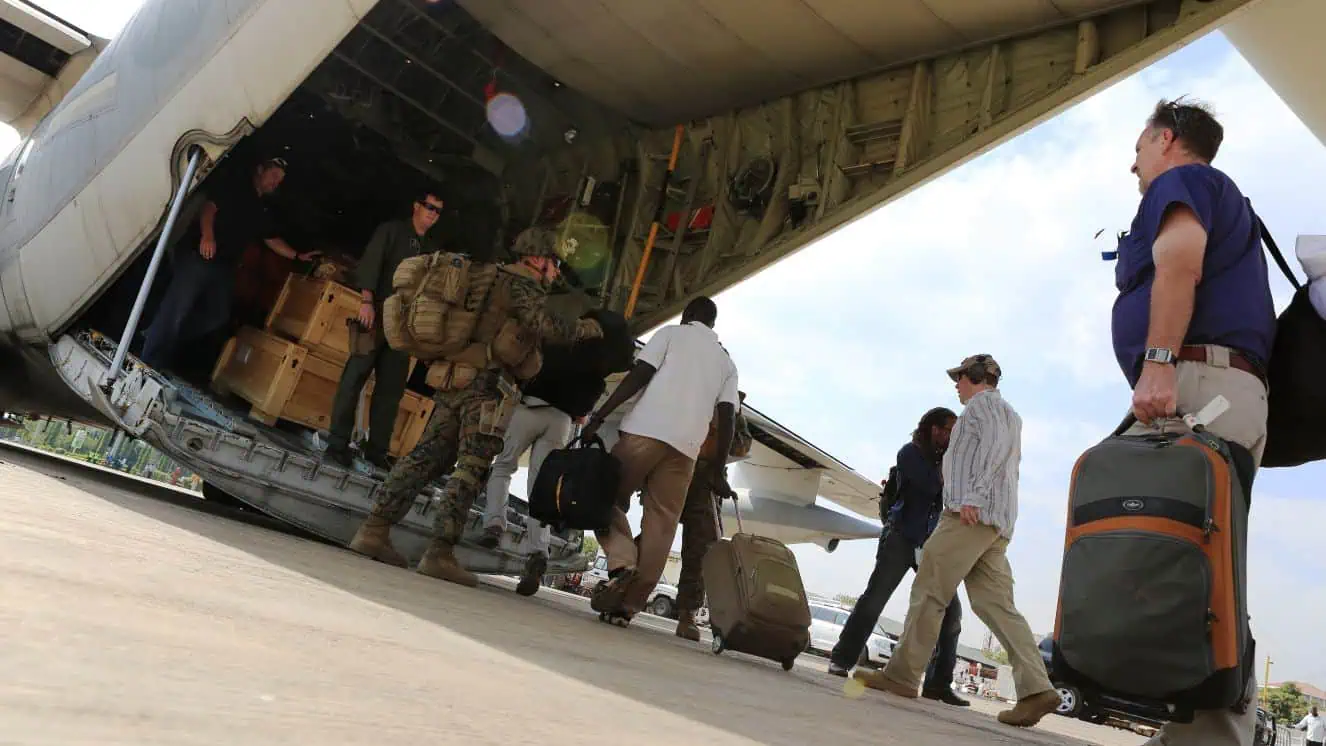 An evacuation from the US embassy, Sudan. Marines and sailors with Special-Purpose Marine Air-Ground Task Force Crisis Response help U.S. citizens into a Marine Corps KC-130J Hercules airplane in Juba, South Sudan.