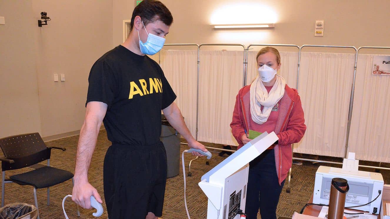 U.S. Army Research Institute of Environmental Medicine researcher Julie Coleman conducts a body composition test on Army Logistics University student 1st Lt. Tom Burcham using a bioelectrical impedance analysis machine during the Army Comprehensive Body Composition Study held at the Williams Multipurpose Room Feb. 7. The study -- which included a traditional Army tape test and bone mineral density tests -- aims to provide data regarding Soldiers' body weight and composition that could be a factor in making changes to the Army Body Composition Program.