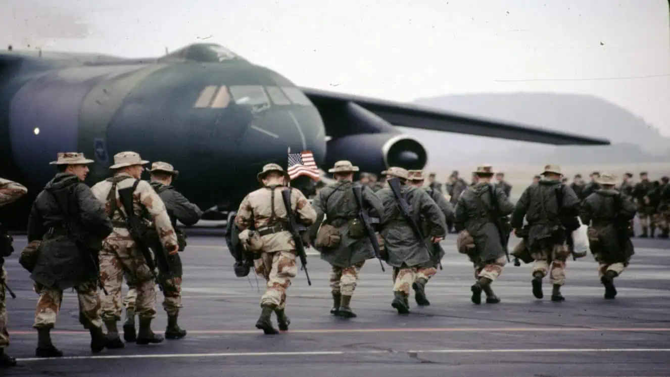 Soldiers deploying to the Gulf War make their way to a plane. A new Gulf War Illness study is out from the NIH.