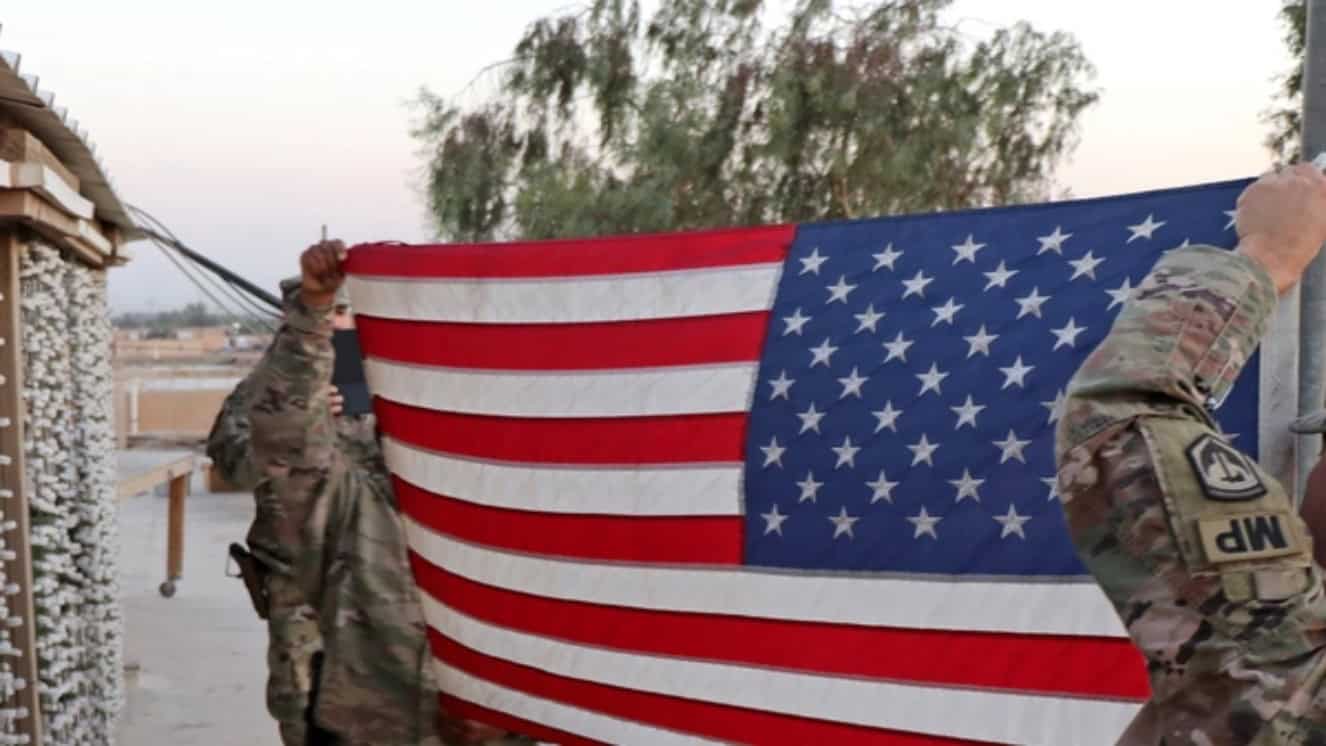 New Jersey National Guard carrying the US Flag, demonstrating proper guidelines from the US Flag Code.
