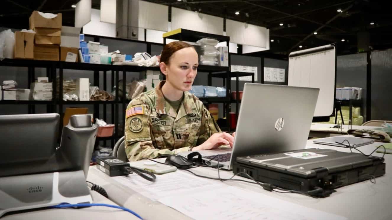Army Capt. Kelly Spencer checks her military email at the nurse’s station.