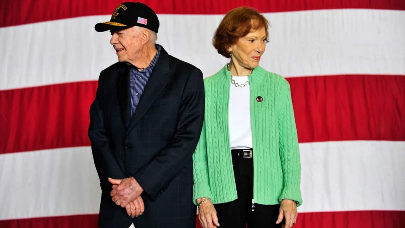 Former first lady Rosalynn Carter receives applause during a lunch hosted aboard the amphibious assault ship USS Peleliu.