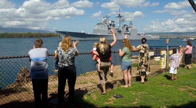 Family and friends wave farewell to Sailors aboard guided-missile cruiser USS Port Royal (CG 73) as it departs Naval Station Pearl Harbor for deployment. Port Royal and guided-missile destroyer USS Hopper (DDG 70) deployed with the San Diego element of Tarawa Expeditionary Strike Group for a deployment to the 5th and 7th Fleet areas of responsibility. The Fat Leonard scandal centers around illicit activity with the 7th Fleet.