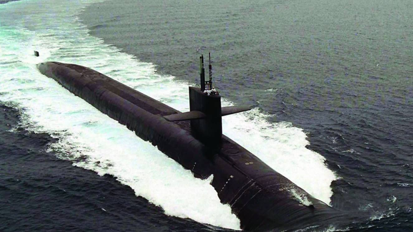 Naval submarine traveling in the water right before several submarine accidents.