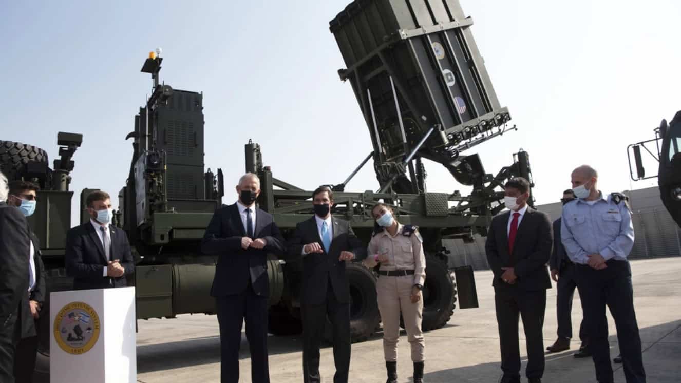 Israeli Minister of Defense Benny Gantz, Defense Secretary Dr. Mark T. Esper, and Israel Defense Forces Lt. Tovah Winick, an Iron Dome battery commander, “shake elbows” in lieu of a handshake, after a tour of the Iron Dome display, Tel Aviv, Israel, Oct. 29, 2020