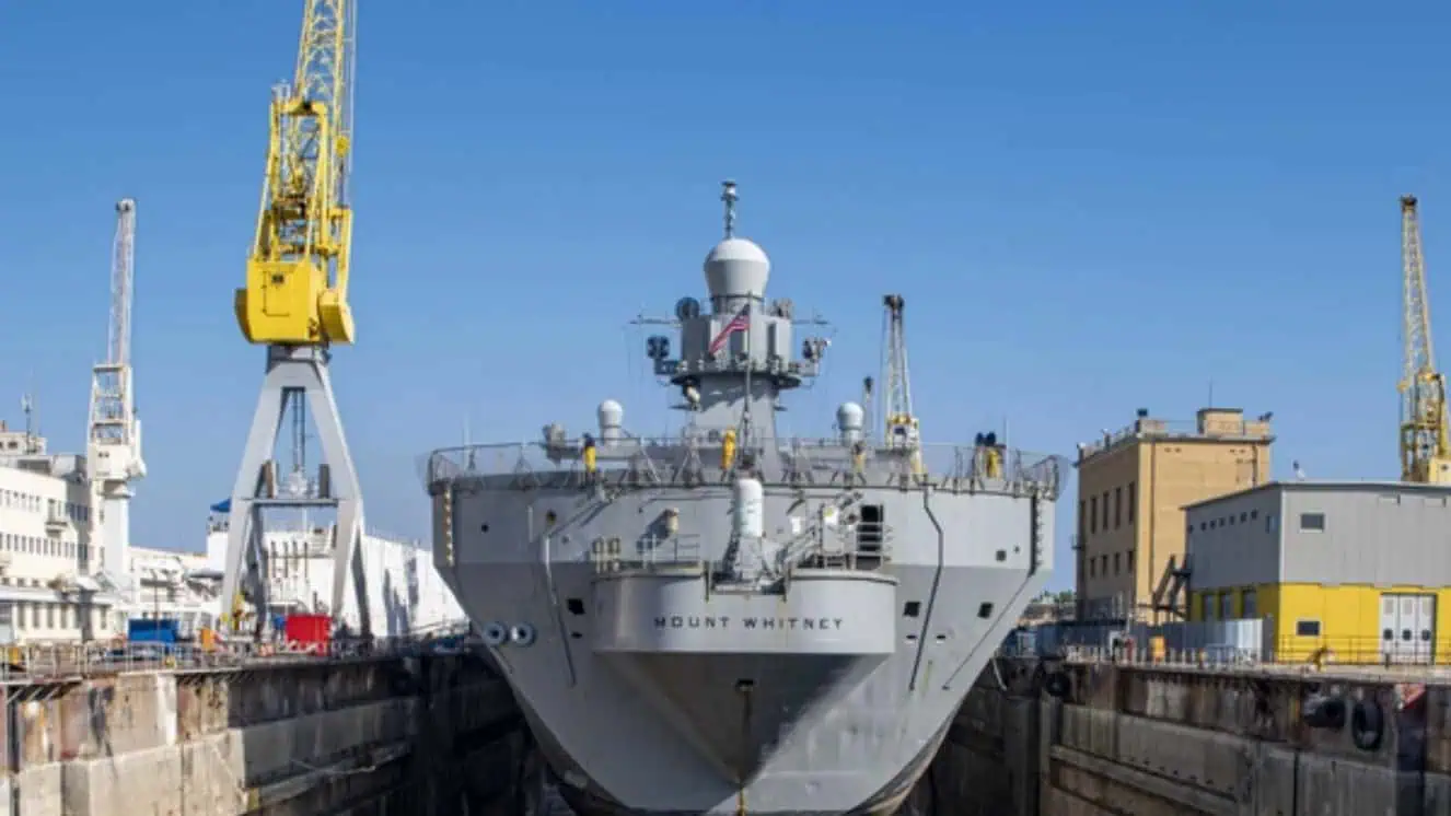 The USS Mount Whitney sitting in a dock.