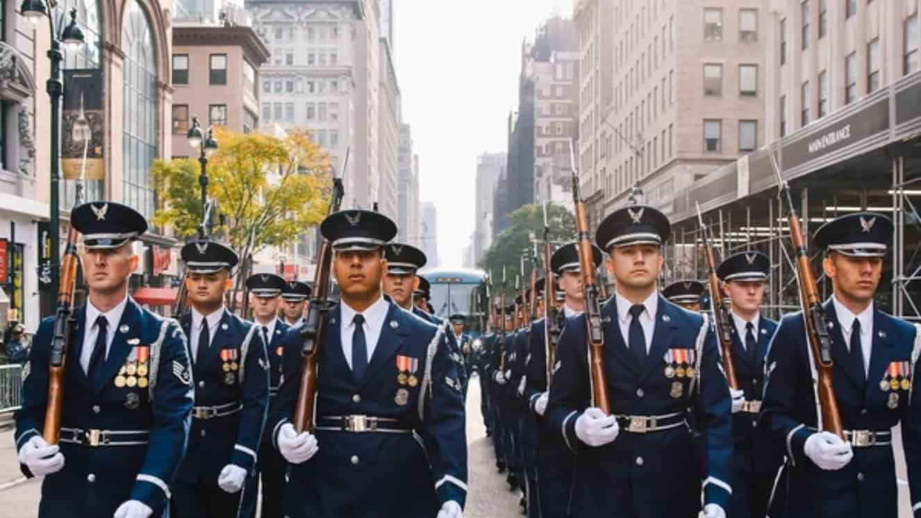 Soldiers marching in a Veterans Day parade.