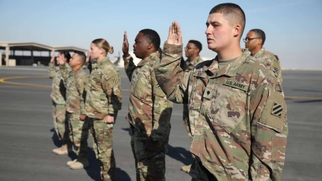 U.S. Army Soldiers, assigned to the 3rd Division Sustainment Brigade, participated in a re-enlistment ceremony at Camp Buehring, Kuwait Dec. 12, 2021 in light of ukraine funding.