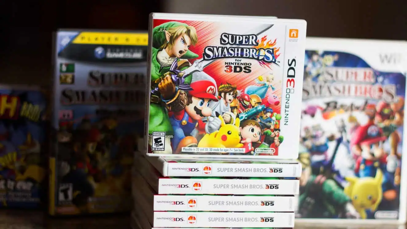 Super Smash Bros. video games in a pile.