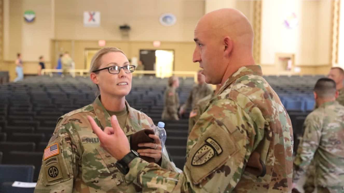 Lt. Col. Meghann Sullivan talks with Command Sgt. Maj. Scott Brinson, 2nd Battalion, 5th Security Force Assistance Brigade during her change of command ceremony, today, at Joint Base Lewis McChord, Washington.