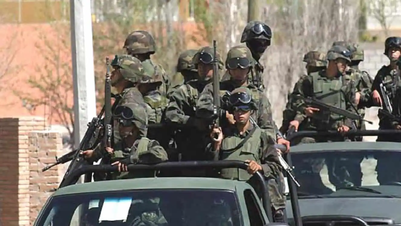 Mexican army in car to find mexican drug cartels.