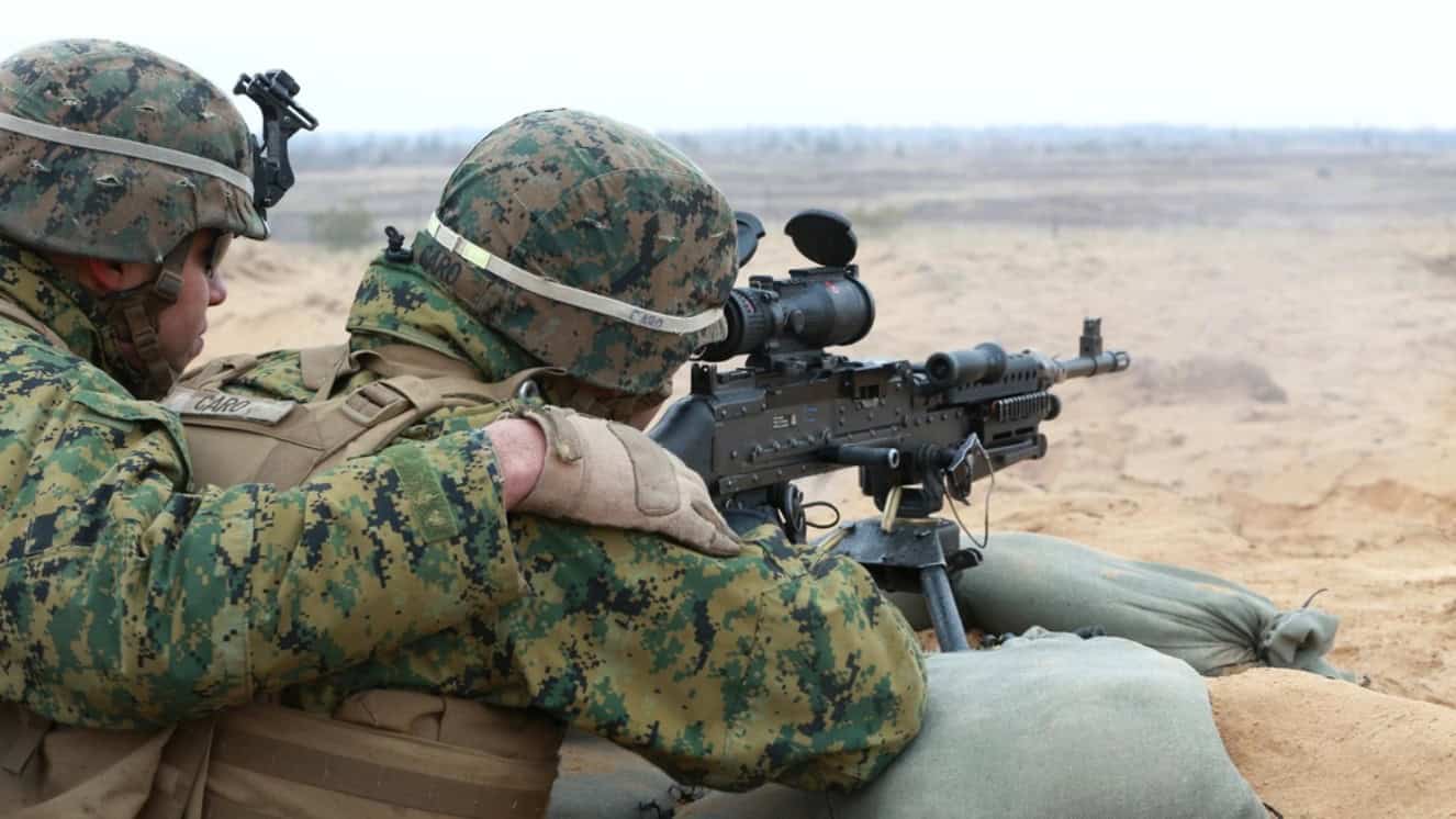 A U.S. Marine with Weapons Company, Black Sea Rotational Force, fires an M240B during a live-fire demonstration, March 30, 2015, as part of a military exercise.