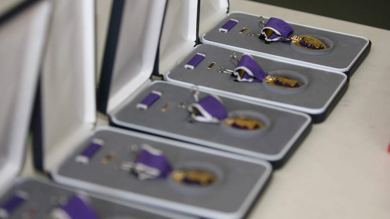 The purple heart award in a case on the table.