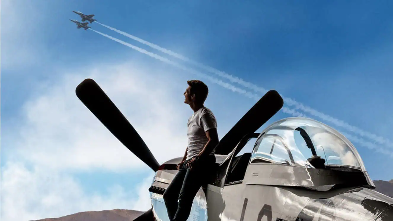 Tom Cruise next to a plane ready for Top Gun 3.