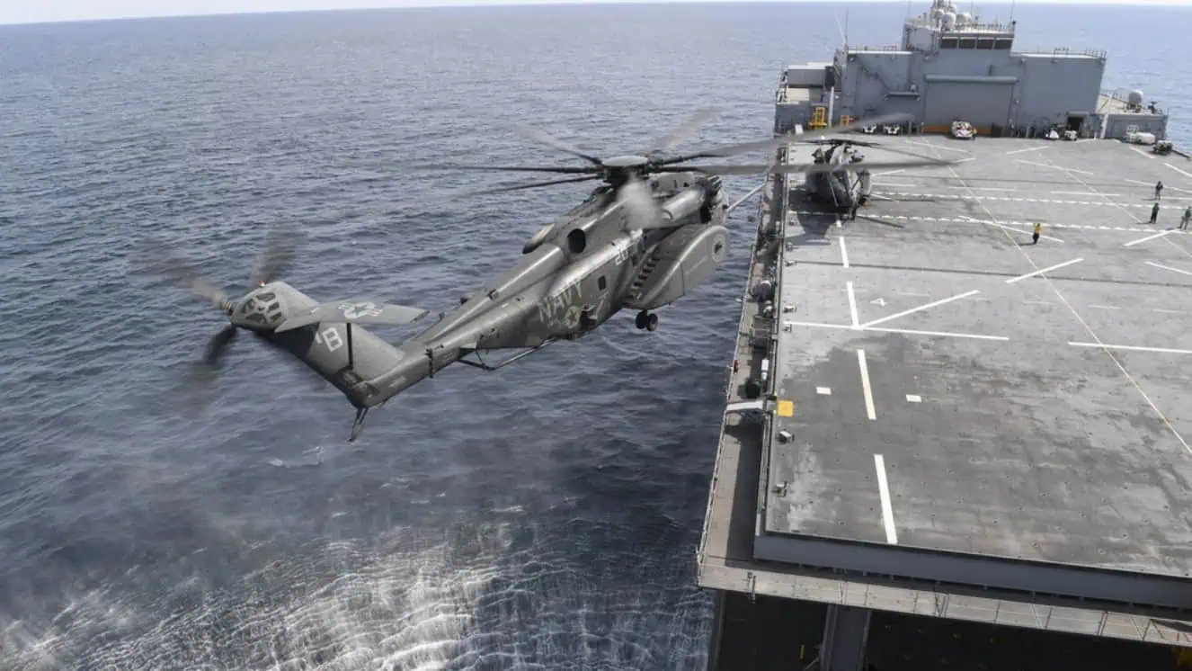 A helicopter landing on the USS lewis b puller.