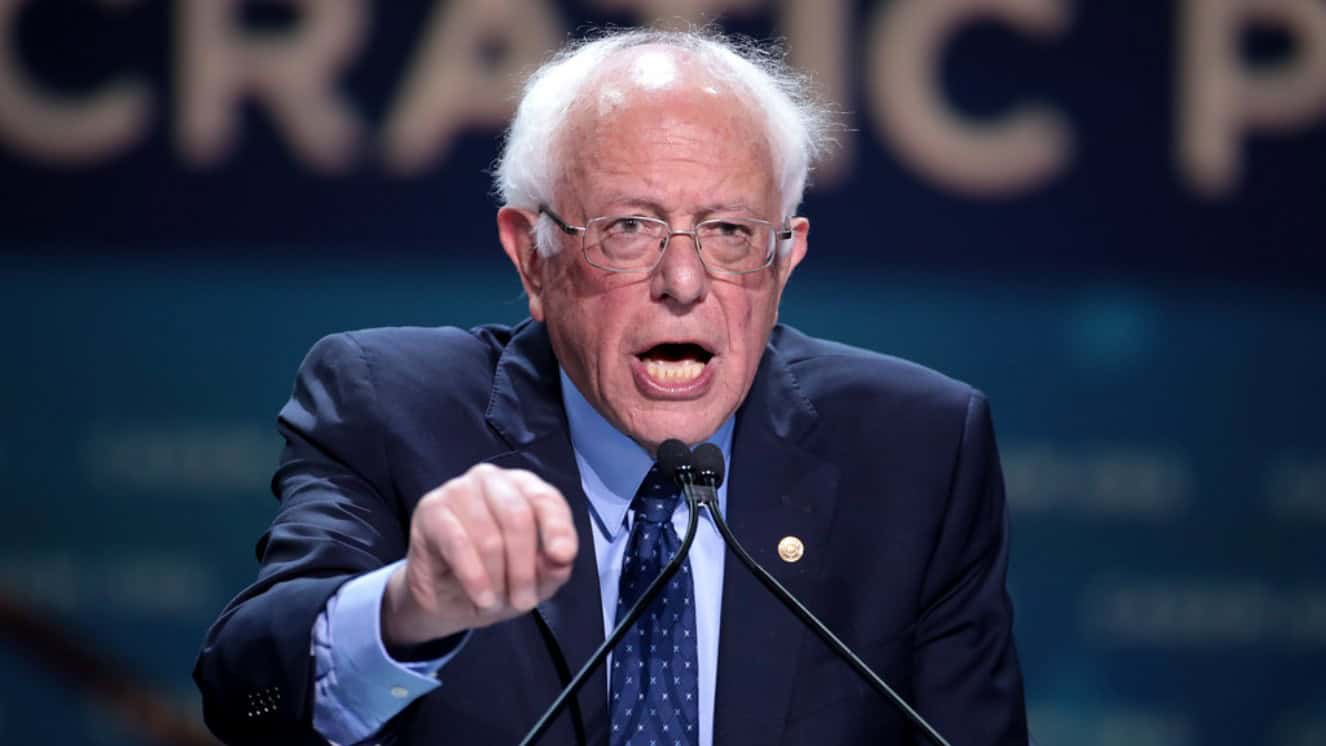 Bernie Sanders Israel stance, talking at podium.