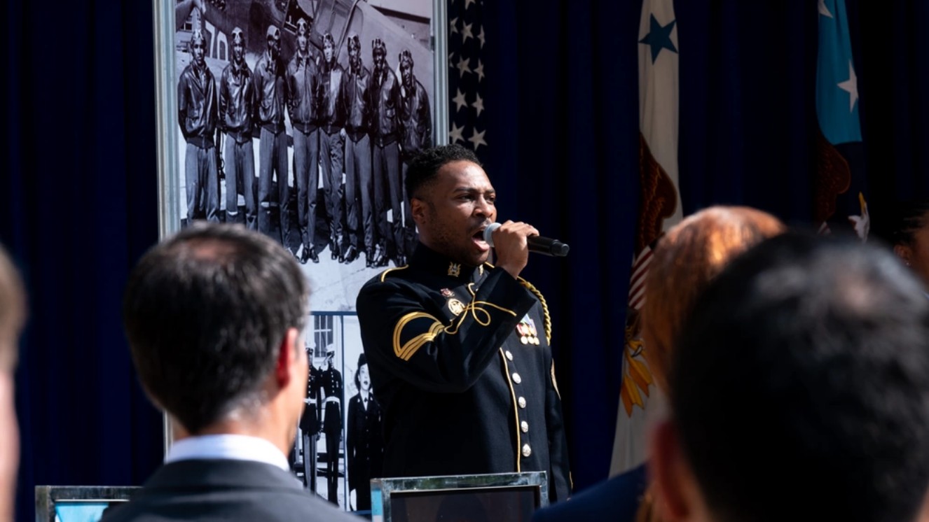 A member of the U.S. Army Band sings the U.S. national anthem during the 75th anniversary of Executive Orders 9980 and 9981, which banned segregation in the Federal Workforce and the Armed Forces, in the Pentagon Courtyard, Washington, D.C., July 26, 2023.