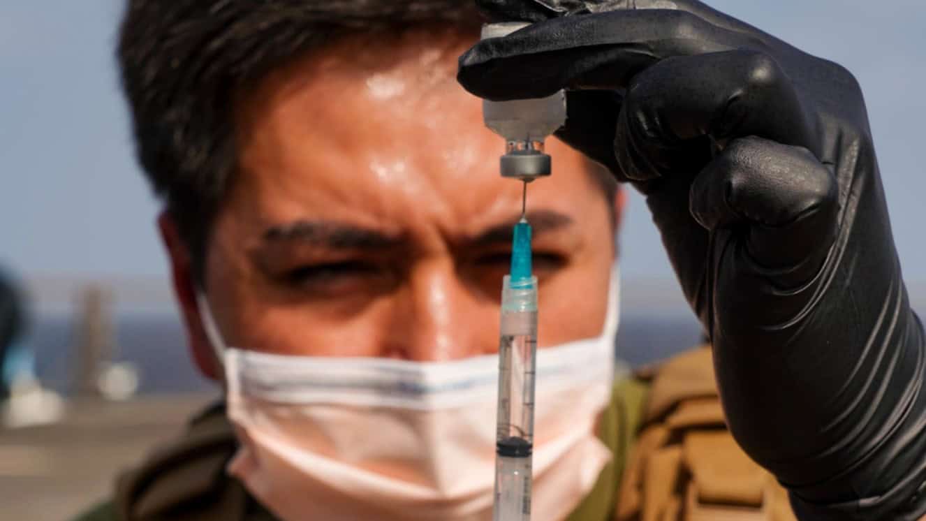 Hospital Corpsman 2nd Class Christopher Maidman prepares ketamine therapy in a syringe during a tactical combat casualty care assessment aboard the amphibious dock landing ship USS Pearl Harbor.
