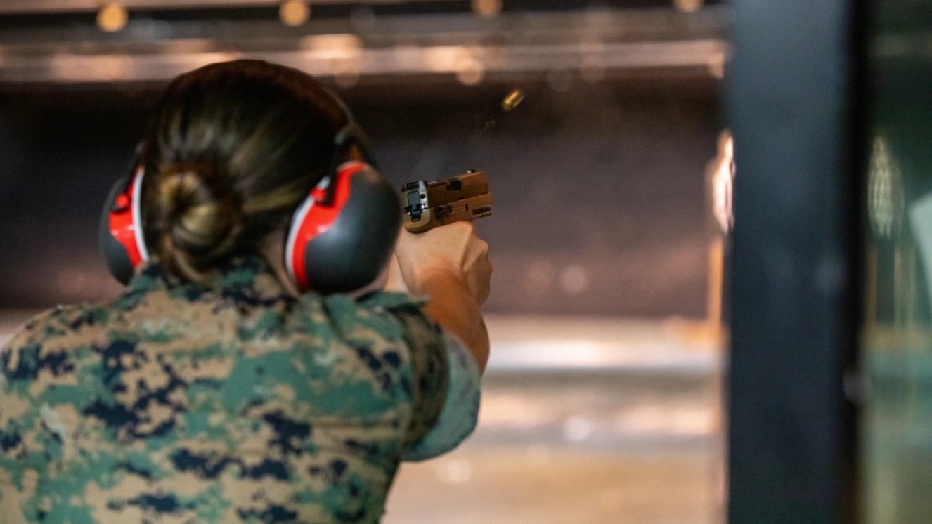 U.S. Marine Corps Cpl. Taylor Allmond, an expeditionary airfield system technician with Headquarters and Headquarters Squadron, participates in a pistol qualification at Marine Corps Air Station Iwakuni, Japan, on Sep. 3, 2021. A shooting range near me prepares Marines to shoot in a variety of scenarios