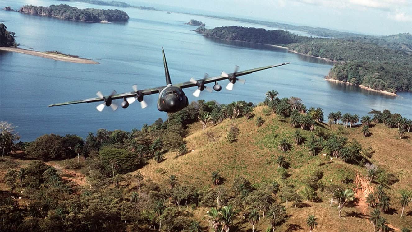 A U.S. Air Force C-130 Hercules transport aircraft takes off from a landing strip in Panama during Operation JUST CAUSE.