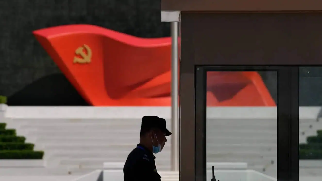 A security guard stands near a sculpture of the Chinese Communist Party flag at the Museum of the Communist Party of China on May 26, 2022, in Beijing in light of the Axis of Evil.