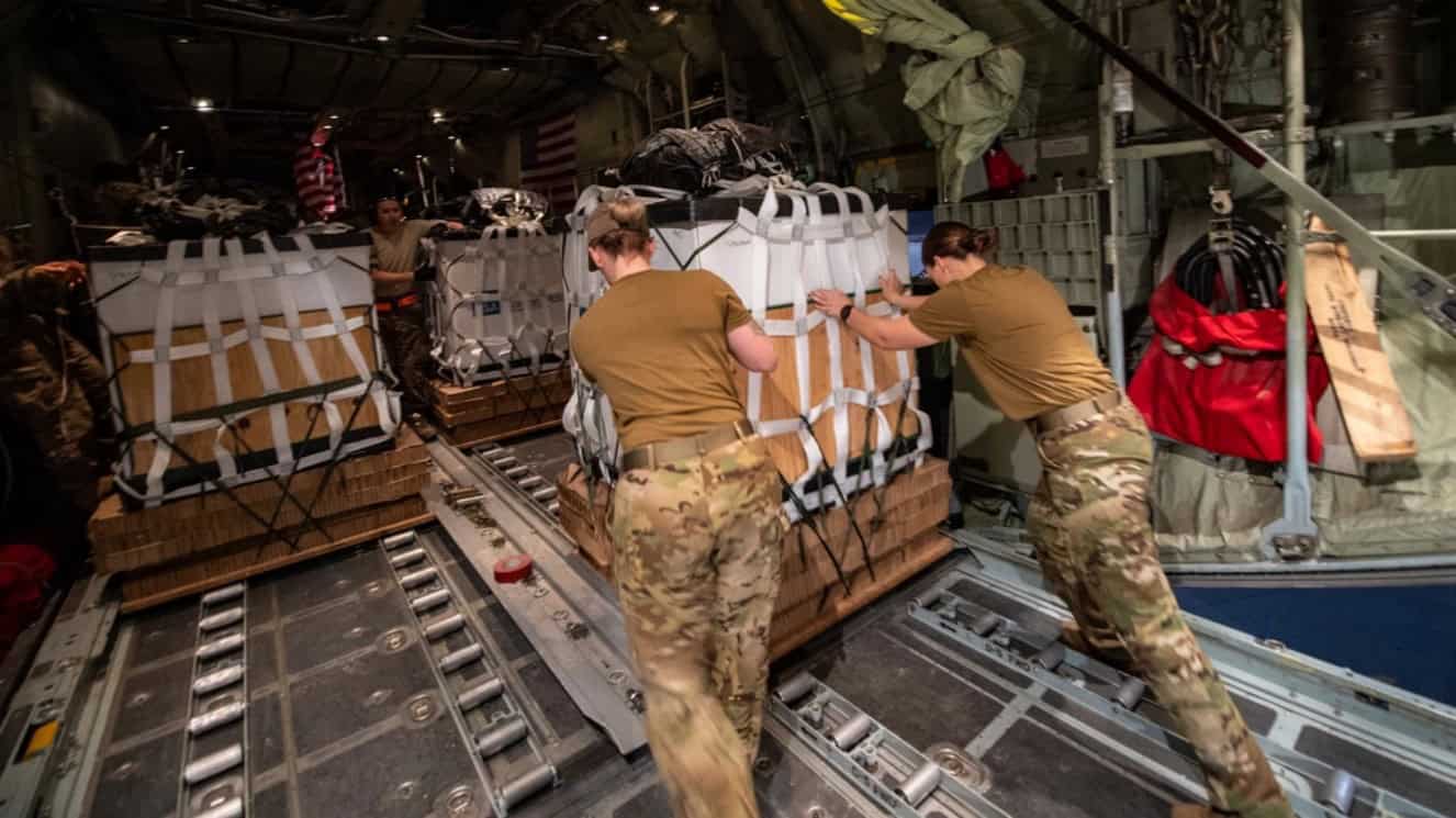 Aircrew assigned to the 779th Expeditionary Airlift Squadron conduct an airdrop from a C-130 cargo plane to resupply friendly forces supporting Operation Inherent Resolve in Southwest Asia.