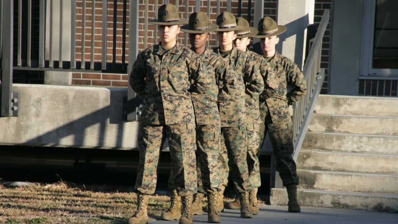 Marine Corps women stand at parade rest during the 69th anniversary of women in the Marine Corps aboard Marine Corps Recruit Depot Parris Island, S.C., Feb. 13, 2012.
