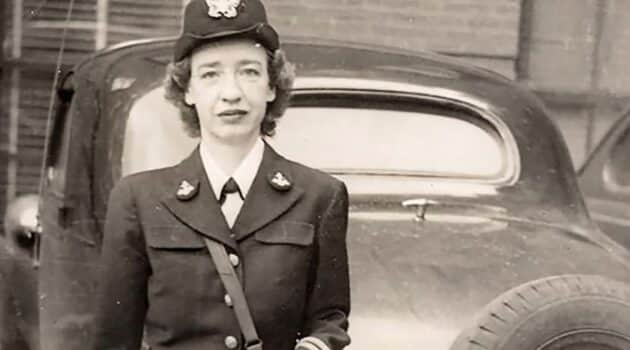 Famous female Veterans standing by a car in military uniform.