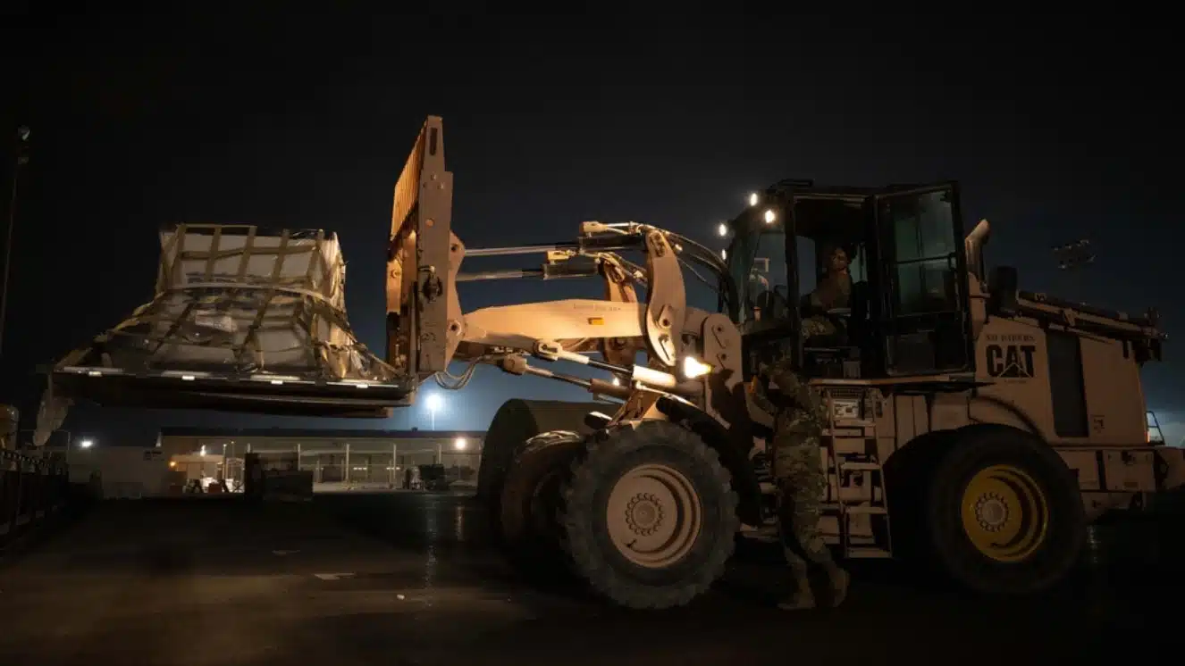 US troops in Gaza during a supply delivery via truck.