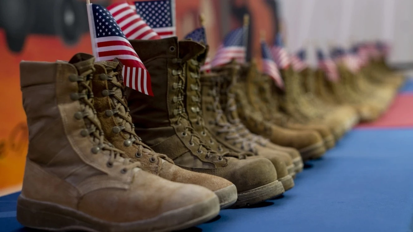 U.S. Airmen from the 332nd Air Expeditionary Wing honor the daily estimated number of veterans who take their own lives, symbolized by 22 pairs of boots in recognition of Suicide Prevention Month. The REACH Vet program is helping lower suicide rates.