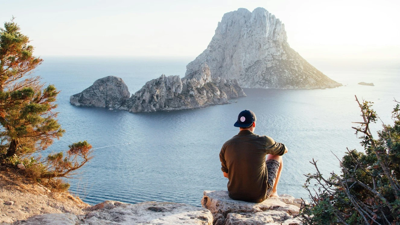 Summer vacation activities, such as hiking and looking at the view.