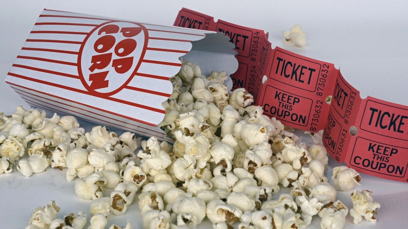 Best comedy movies with a popcorn bucket and movie tickets.