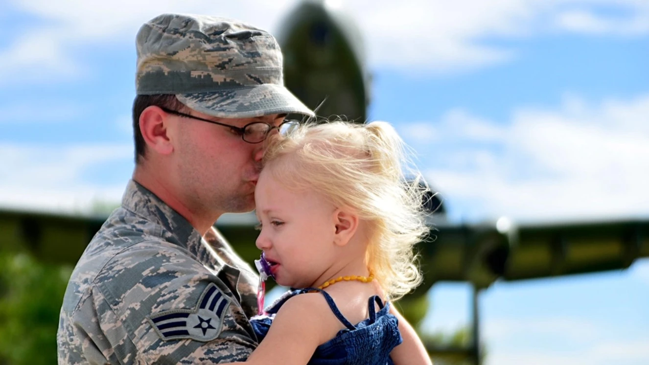 Happy fathers day military dads, with a father holding his daughter.