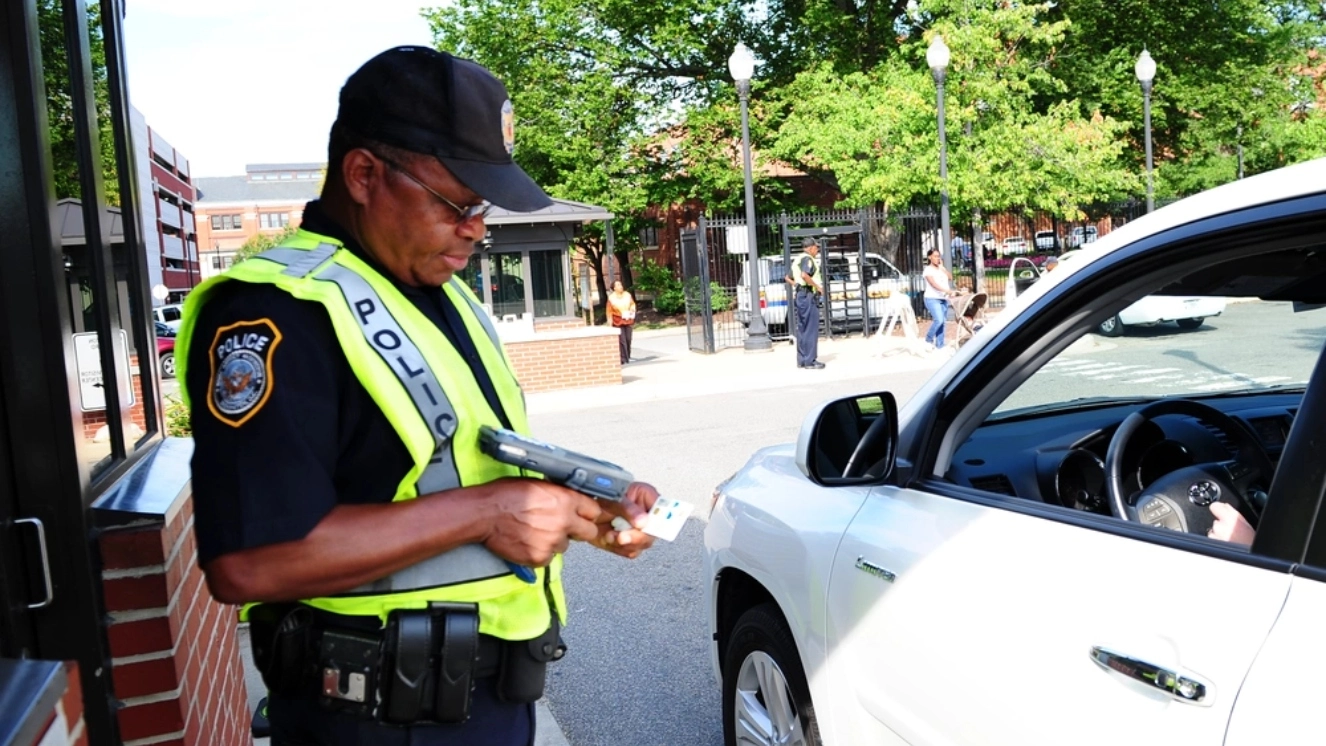 Can Veterans Get on Military Bases? Department of Defense Police Cpl. O.K. Harris checks personnel and visitor identification at the Washington Navy Yard.