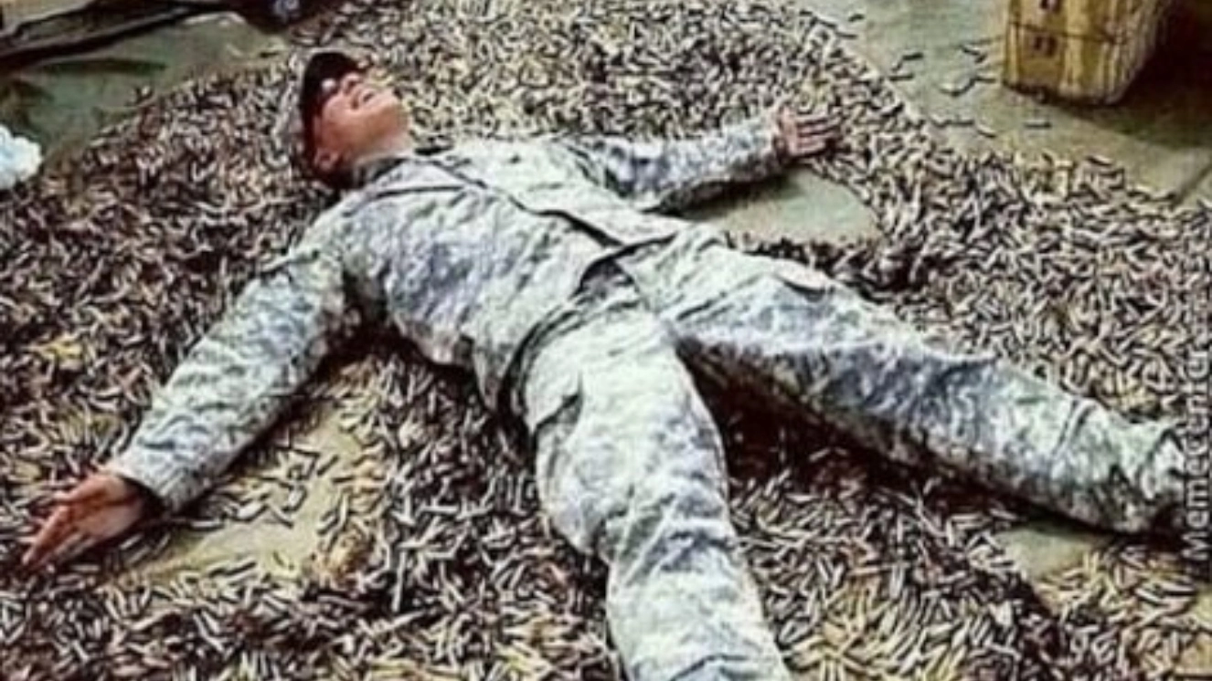 Army memes of Soldier making a snow angel.