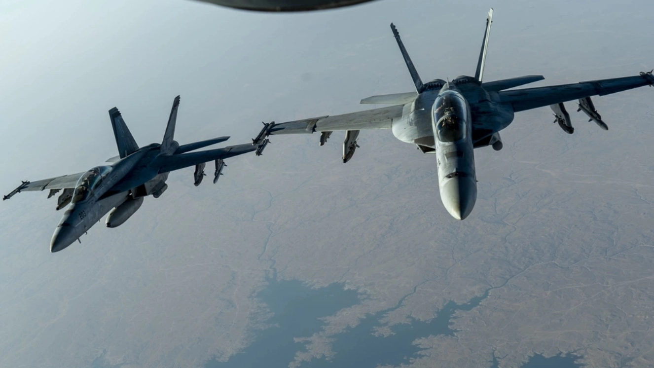 Two U.S. Navy F/A-18F Super Hornet, from the "Mighty Shrikes" of Strike Fighter Squadron (VFA) 94, aka best fighter jets, flies over the U.S. Central Command area of responsibility during a mission in support of Operation Inherent Resolve, Sept. 30, 2020.