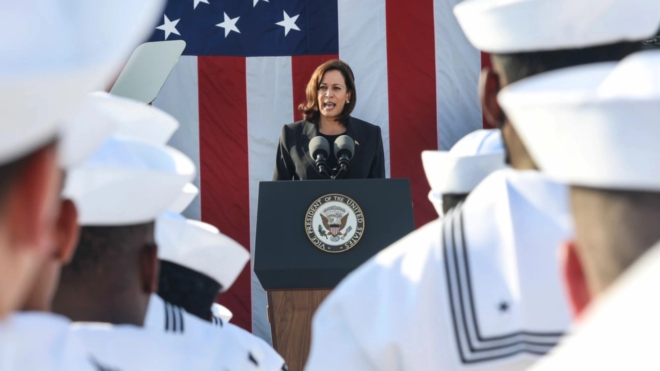 Kamala Harris talking to Sailors. Get the answer to did Kamala Harris serve in the military.