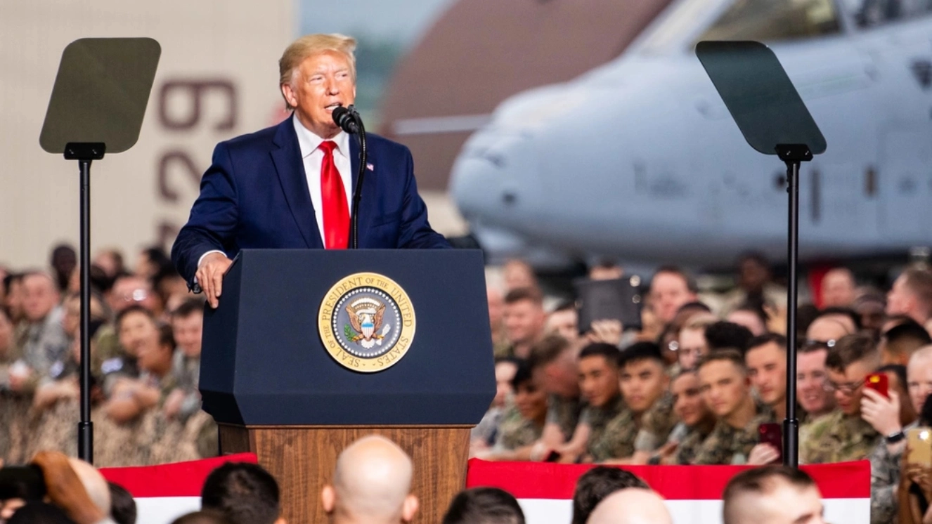 U.S. President Donald J. Trump addresses a crowd of joint service members stationed across the Korean Peninsula during his visit to Osan Air Base, Republic of Korea, in light of Project 2025.