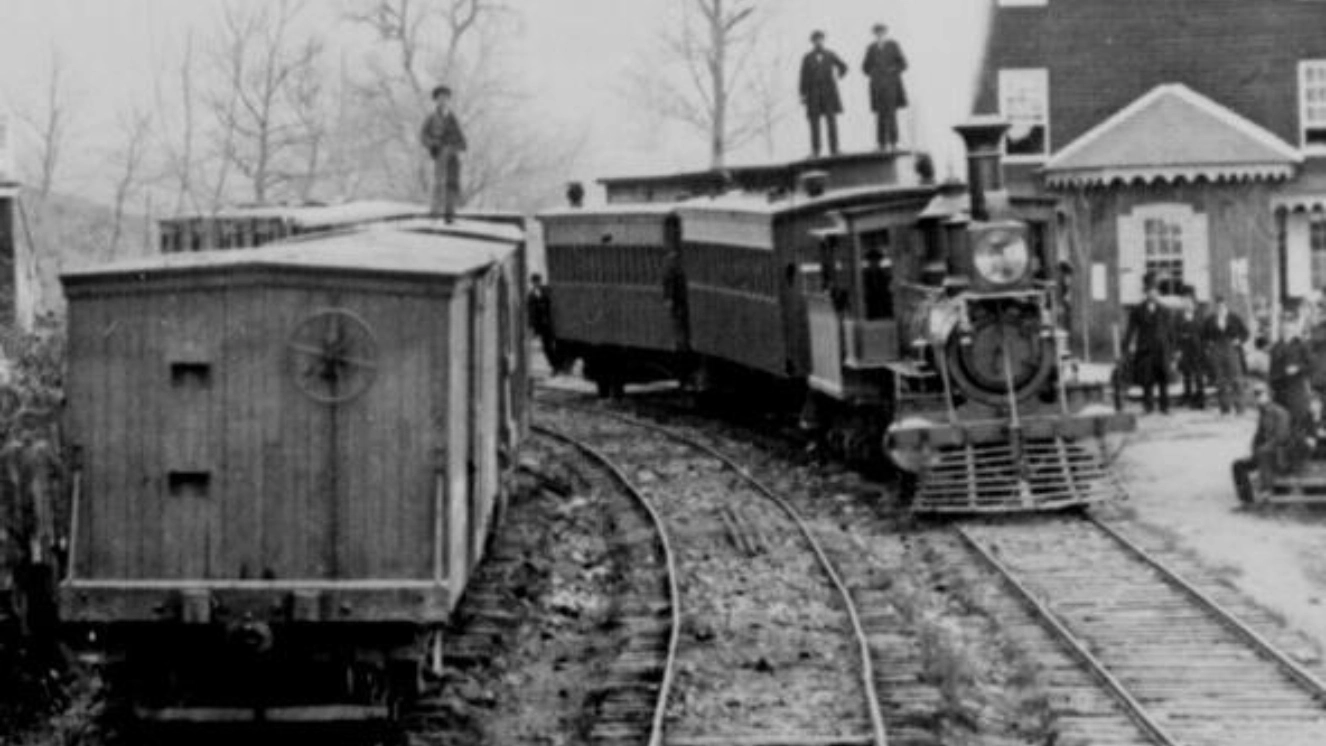 Trains of the Civil War with Soldiers standing on top of them.