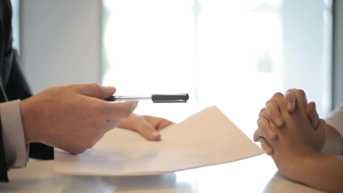 Signing a document about veterans life insurance.