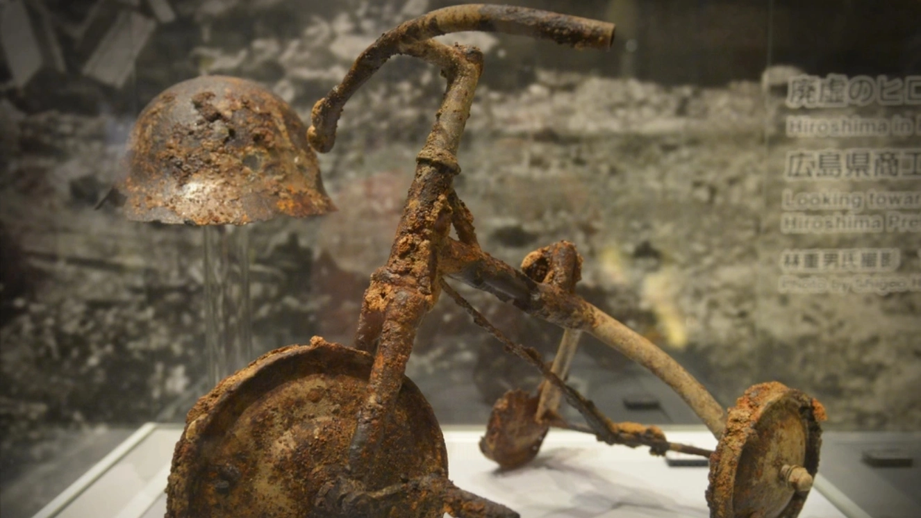 A tricycle and helmet are displayed at Hiroshima Peace Memorial Museum, Hiroshima, Japan, June 1, 2016 representing the atomic bombings of Hiroshima and Nagasaki.